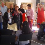 People singing and doing actions to the songs