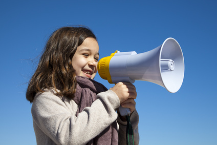 Picture of a girl with a megaphone: Shout out what God has done!
