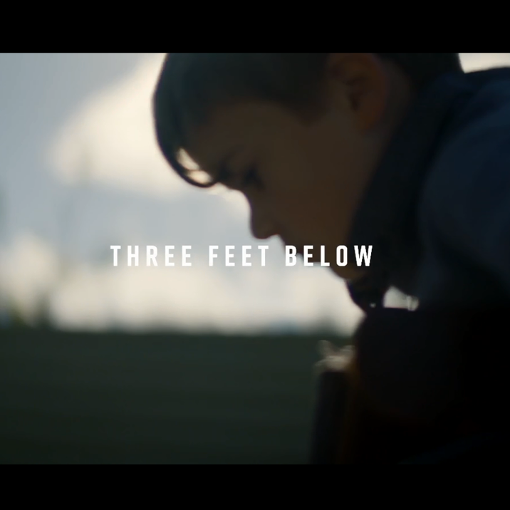 Evan as a child with the words Three Feet Below written over the image