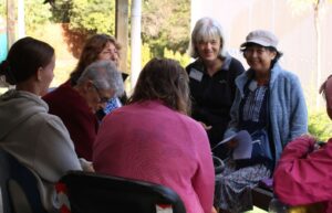Group chatting outside on porch