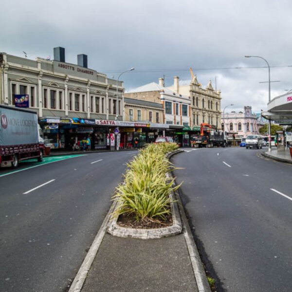 Looking down the middle of Karangahape road, no cars, it's a gloomy day