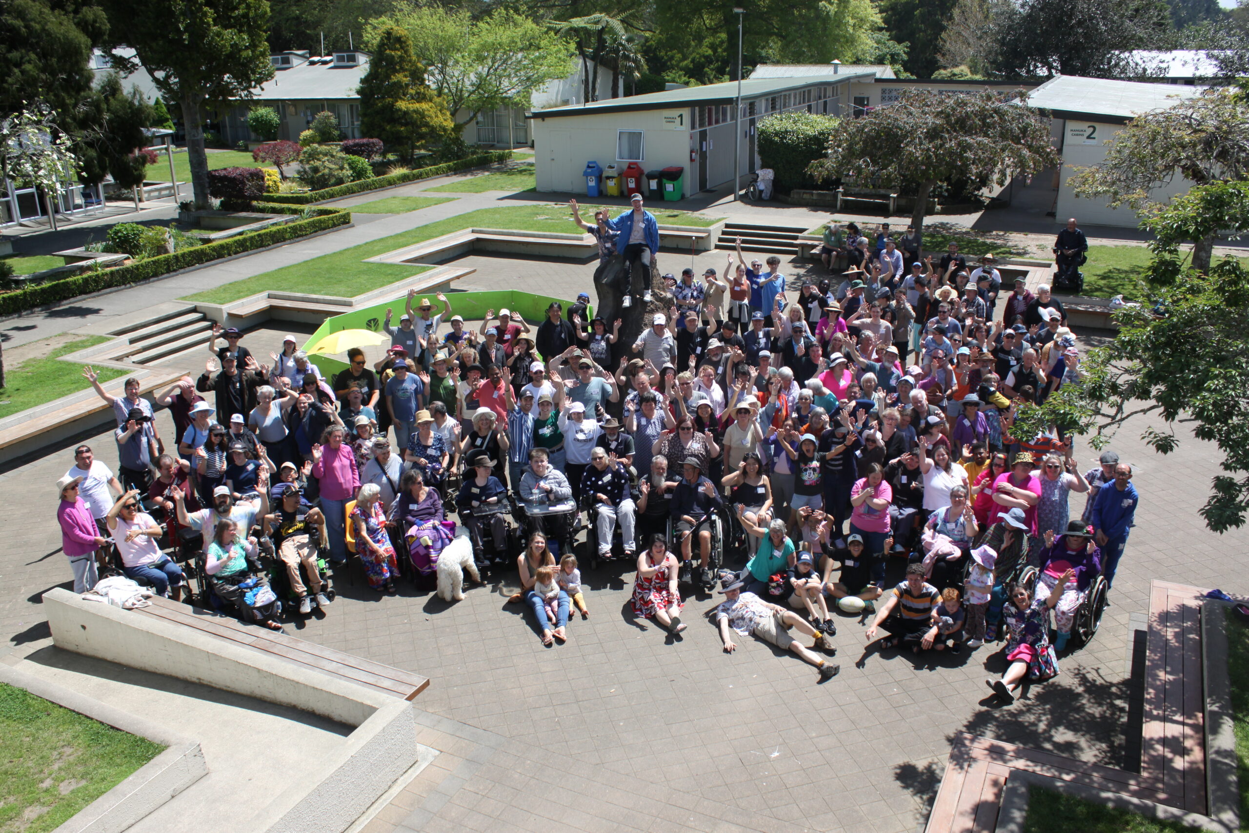 Large bird's eye view group photo of a few hundred people who attended a National Camp