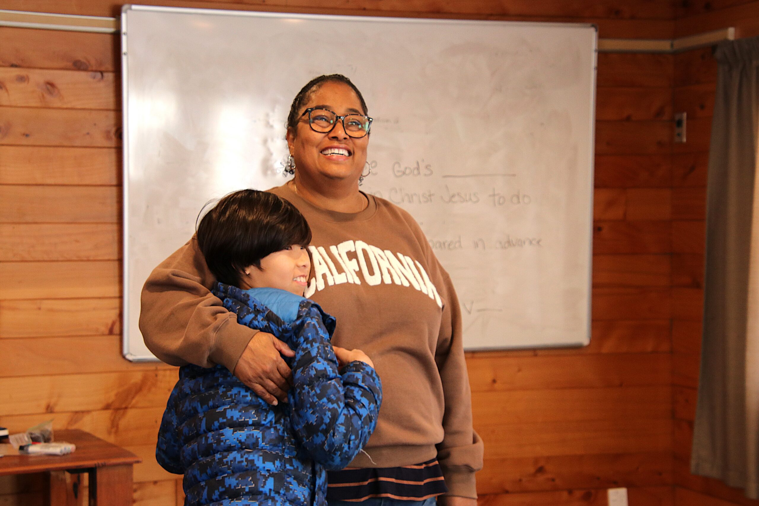 Donna, who works for Children's Bible Ministries New Zealand and was the Youth Programme Leader for Family Camp in 2025, is pictured with a young man who participated in her programme. This photo was taken at Family Camp 2025. The camp is an event run by Elevate for families with disabilities.
