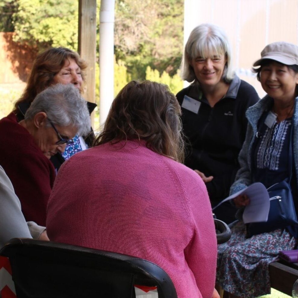 Group chatting outside on porch
