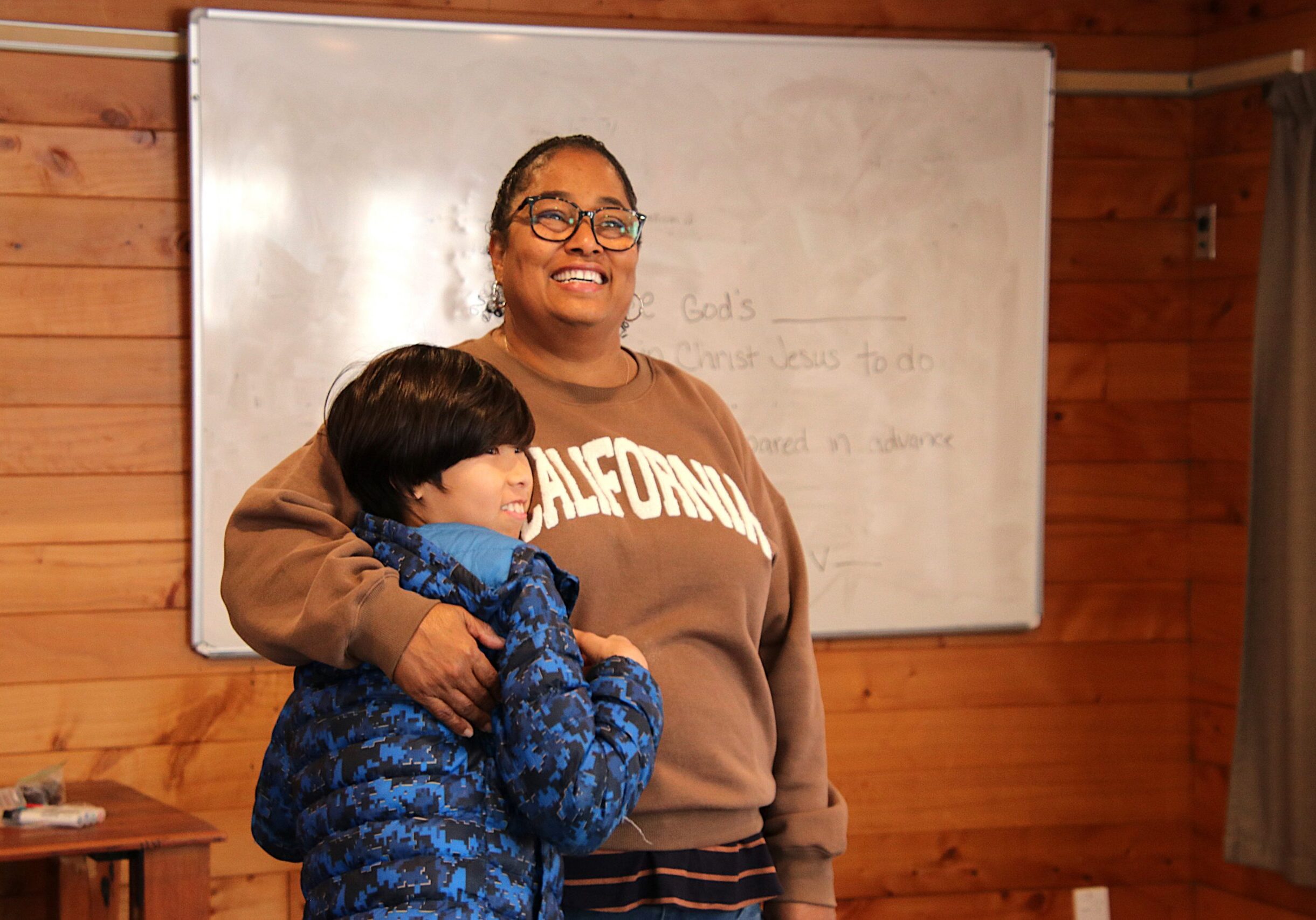 Donna, who works for Children's Bible Ministries New Zealand and was the Youth Programme Leader for Family Camp in 2025, is pictured with a young man who participated in her programme. This photo was taken at Family Camp 2025. The camp is an event run by Elevate for families with disabilities.